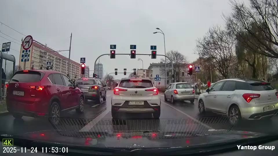Real 4K dash cam footage of a daytime city intersection