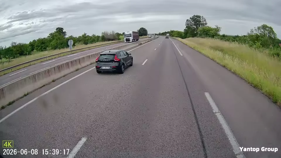 Real 4K dash cam footage of a daytime highway &mdash; cars and lane detail visible down the road