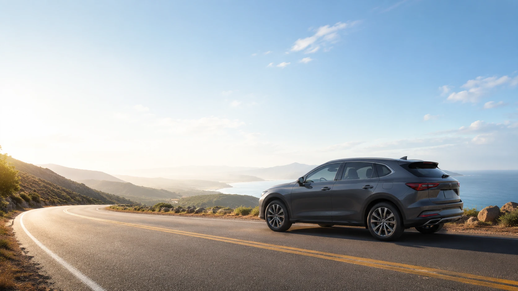 SUV on a panoramic mountain coastal road at sunset — road trip with a Dashline dash cam